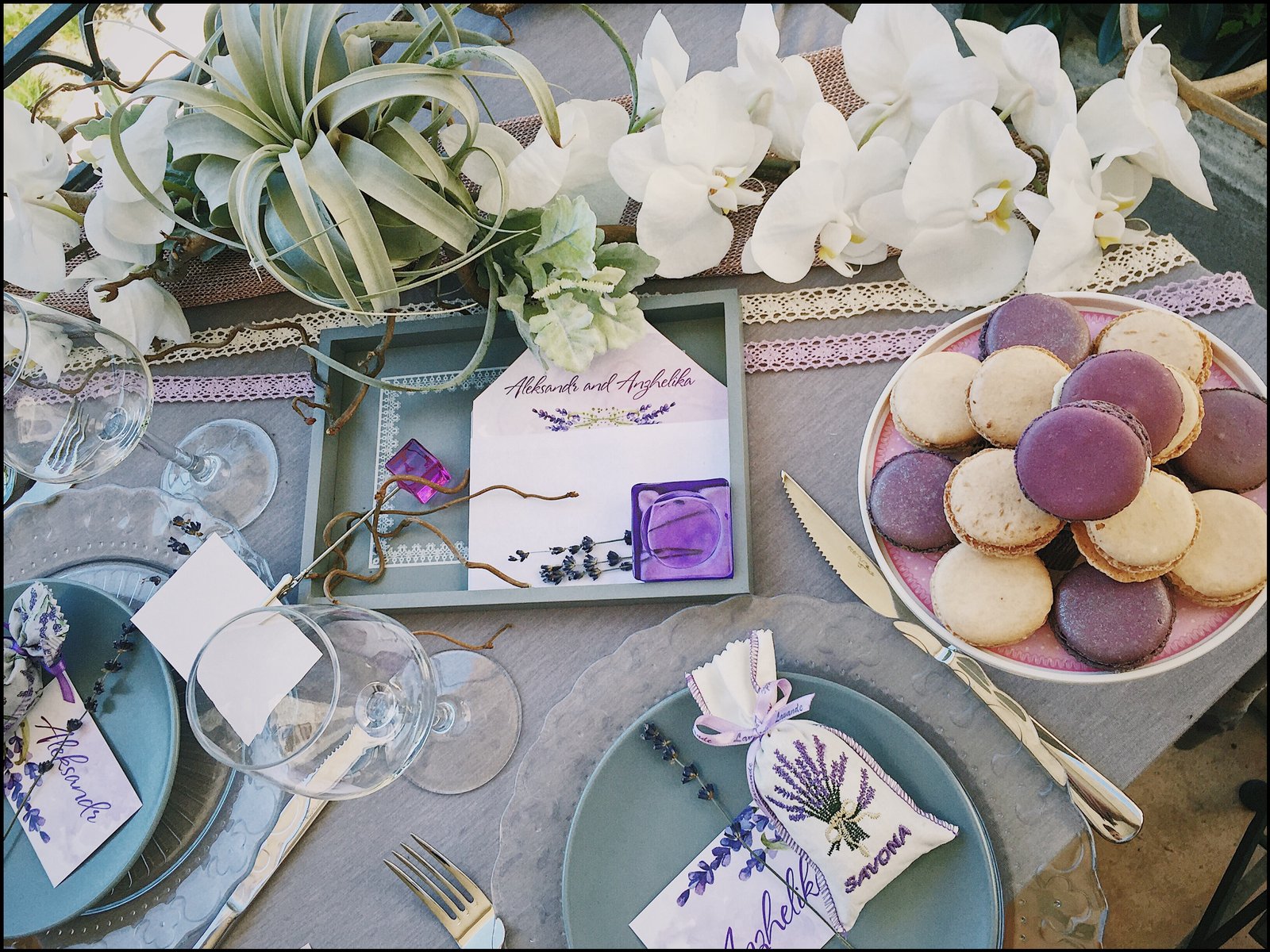 A wedding table setting with flowers, cake and handwritten details