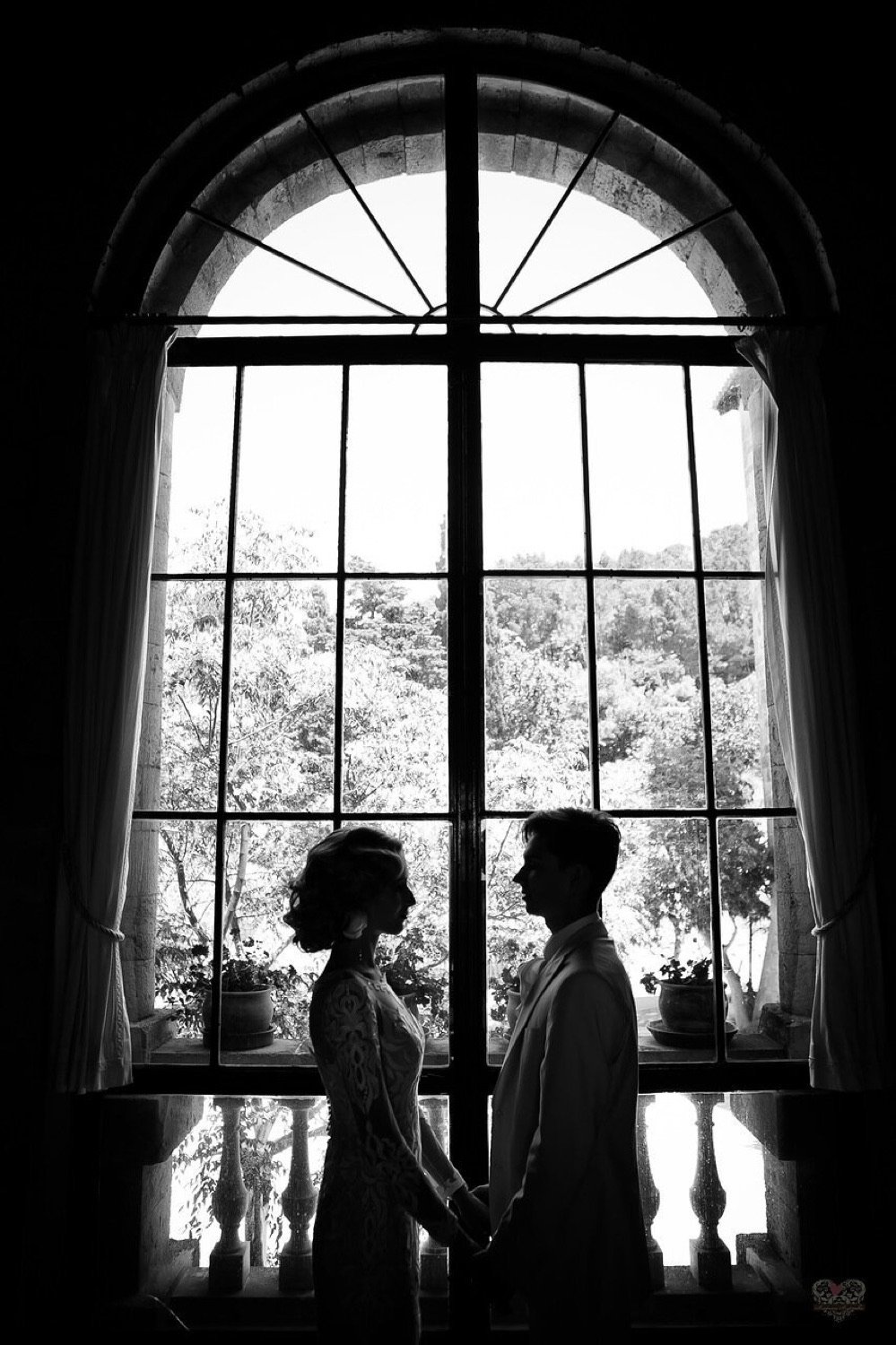 A couple framed in a quiet moment before their wedding